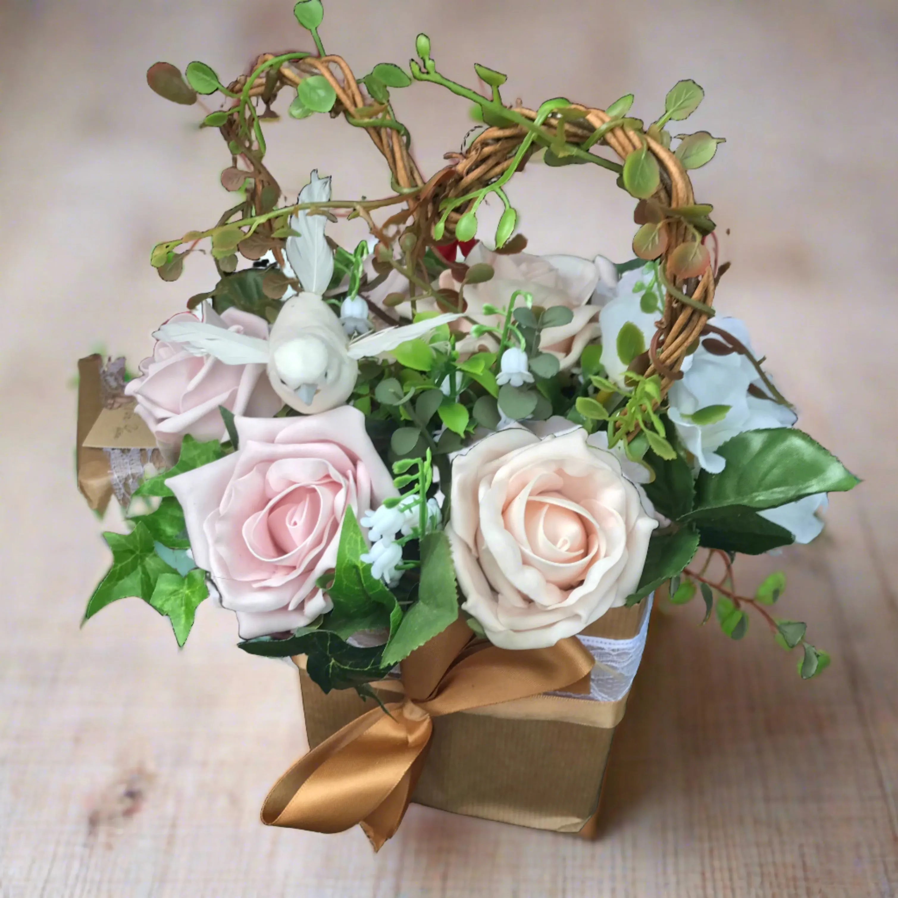 flower arrangement of artificial mocha foam roses in a gift bag