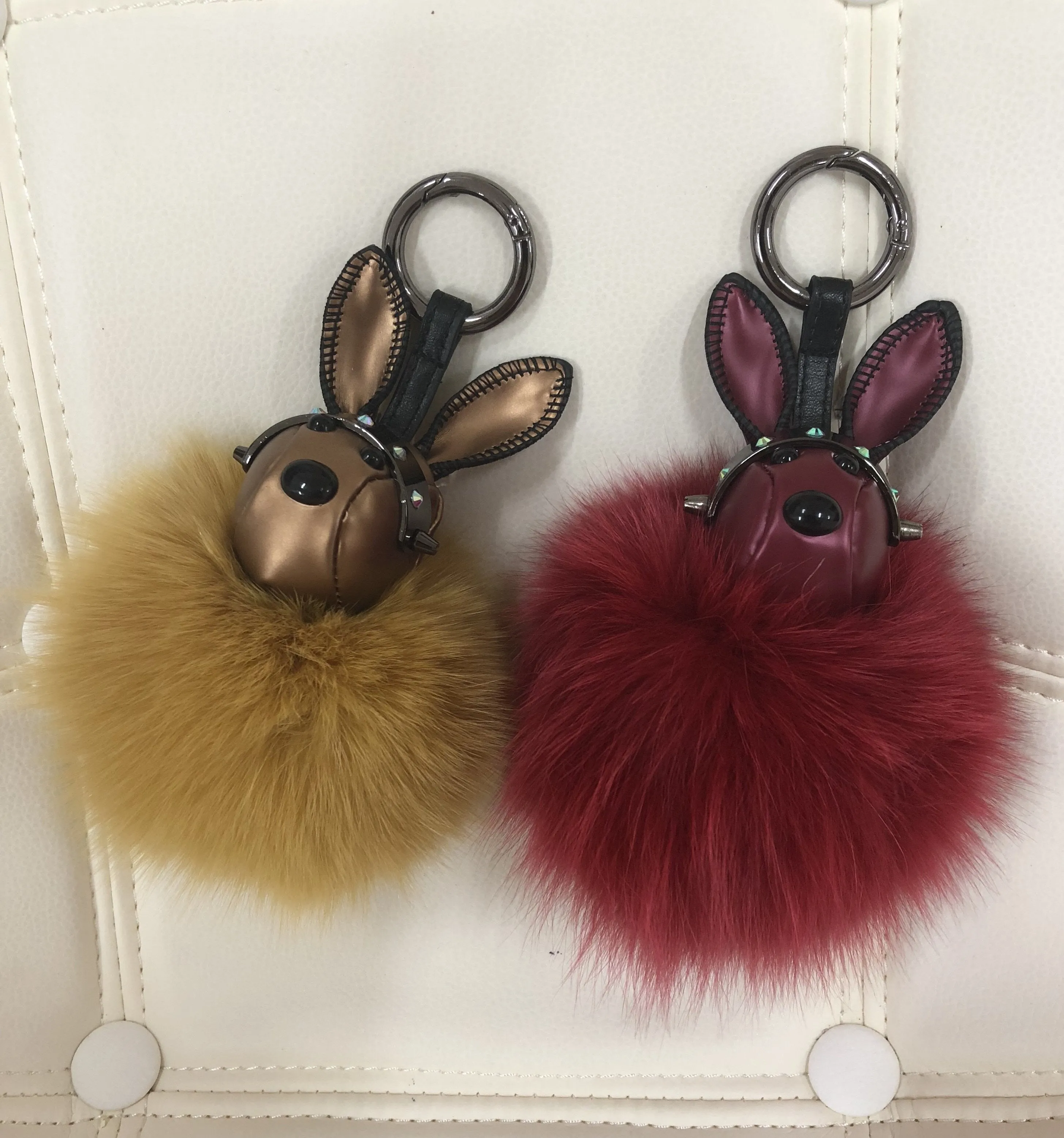 Leather rabbit with fur ball bag charm gold/maroon color